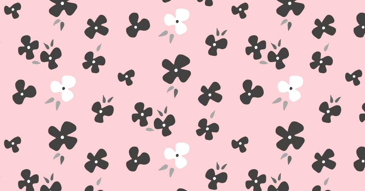ピンクの背景に白と黒の花のパターン