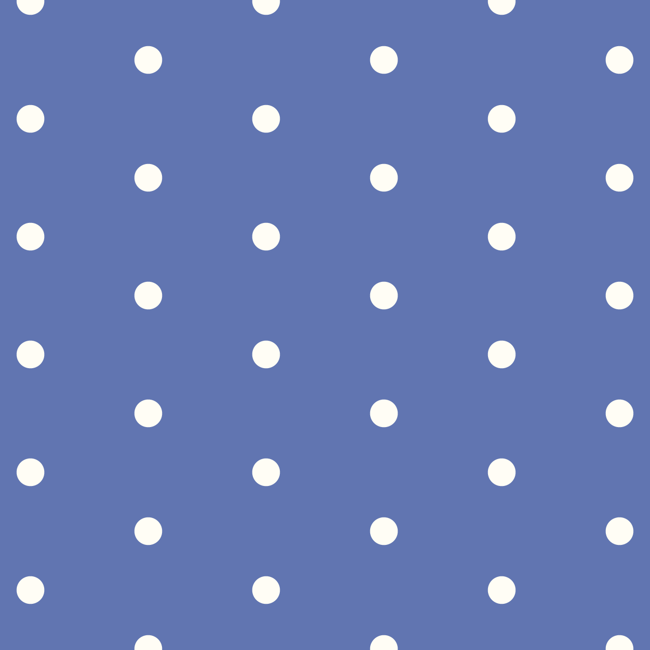 青の背景にシンプルなクリーム色のドットのパターン