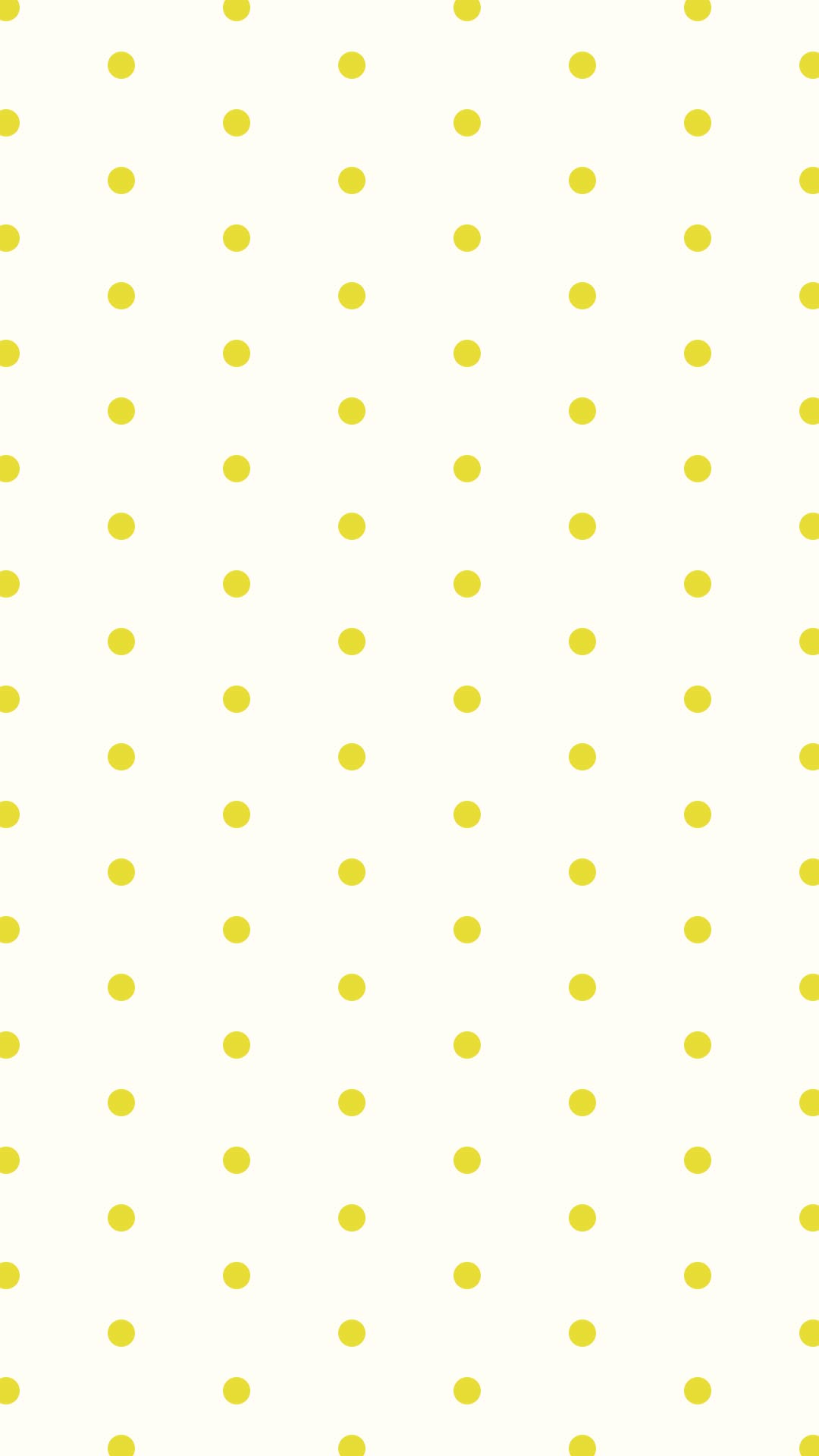 クリーム色の背景にシンプルな黄色のドットのパターン