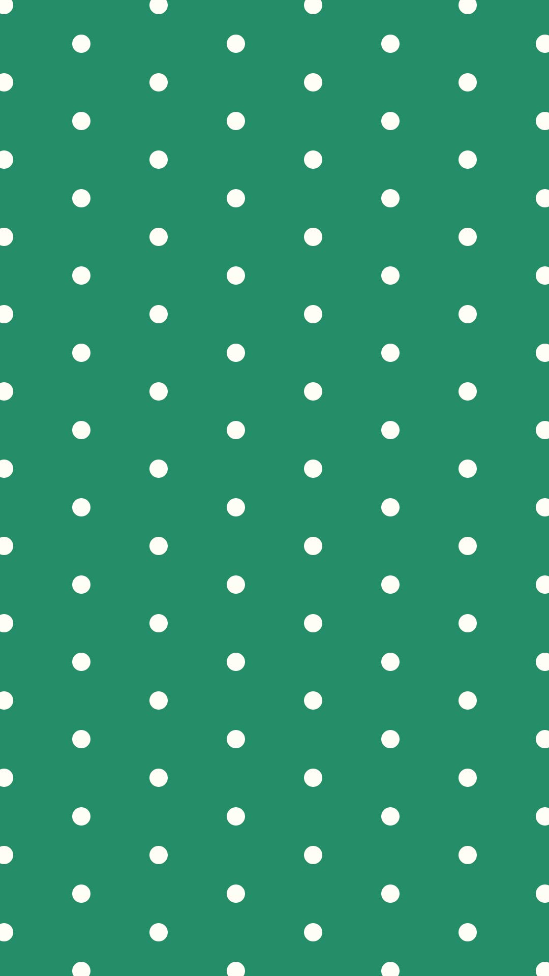 緑色の背景にシンプルなクリーム色のドットのパターン