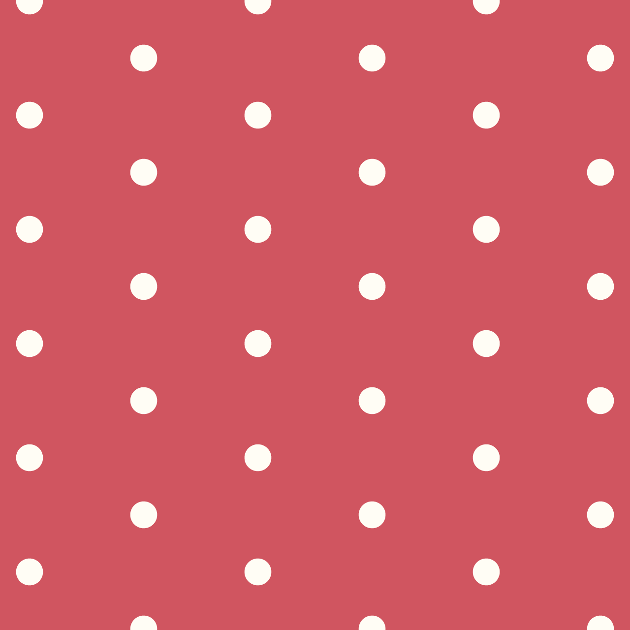 赤の背景にシンプルなクリーム色のドットのパターン