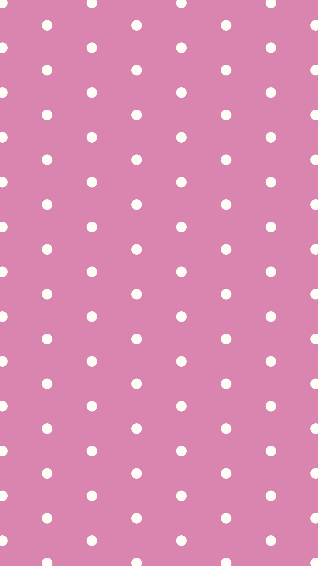 ピンクの背景にシンプルなクリーム色のドットのパターン