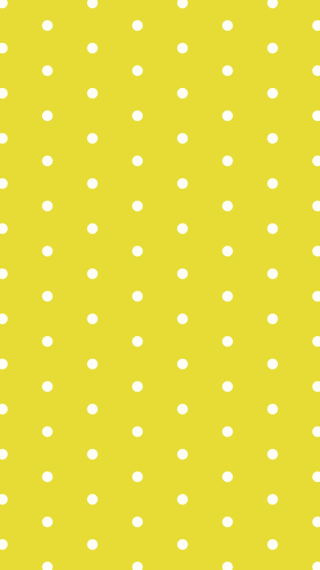 黄色の背景にシンプルなクリーム色のドットのパターン