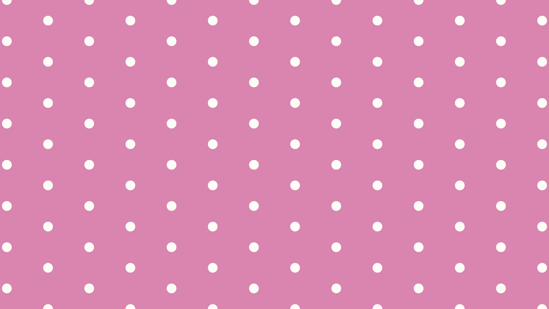 ピンクの背景にシンプルなクリーム色のドットのパターン