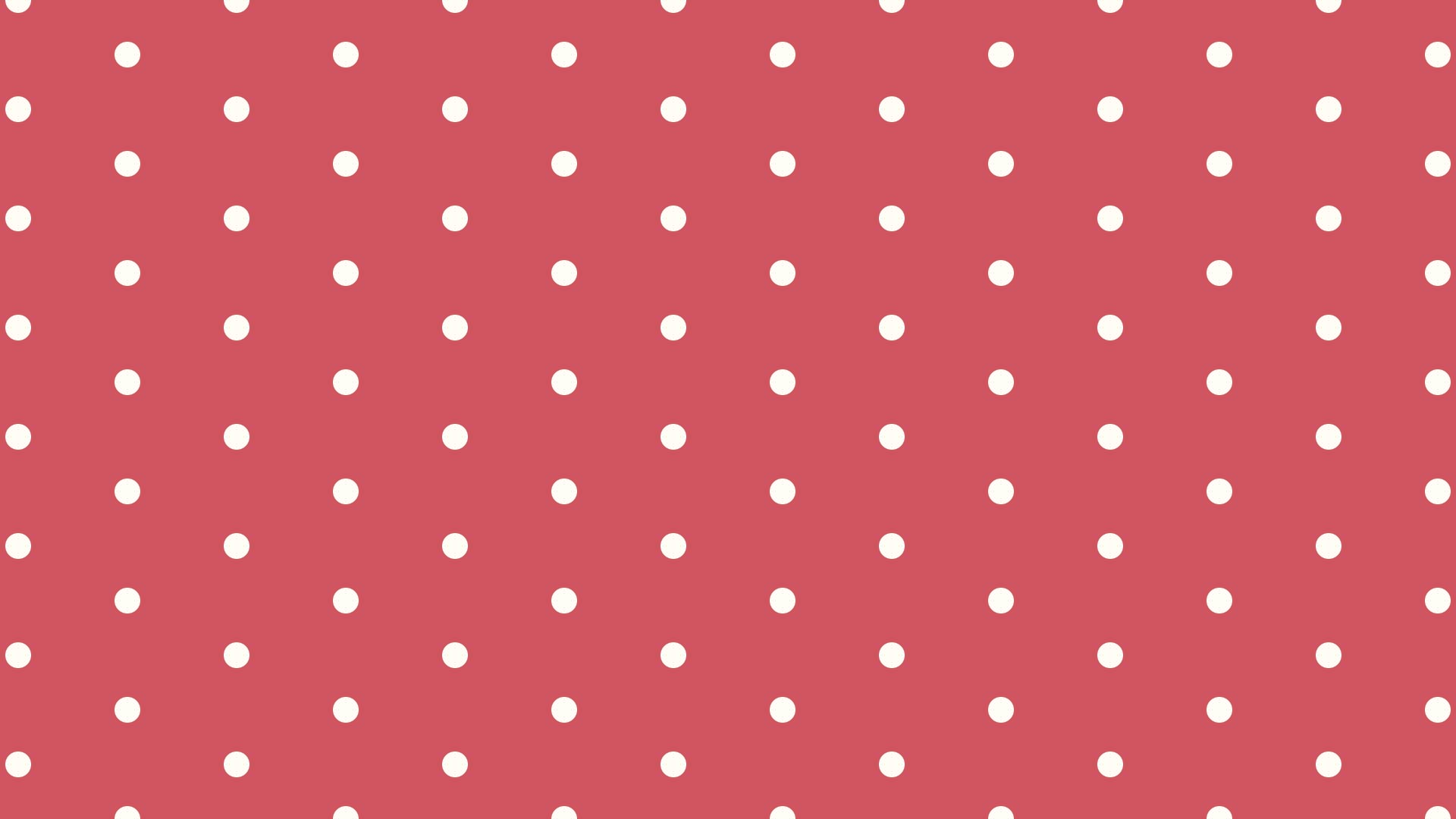 赤の背景にシンプルなクリーム色のドットのパターン